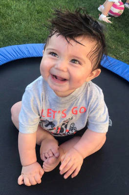 Showing off “helmet hair.”