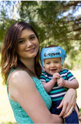 Jennifer Wolbach holding Greyson at his cranial orthosis appointment.